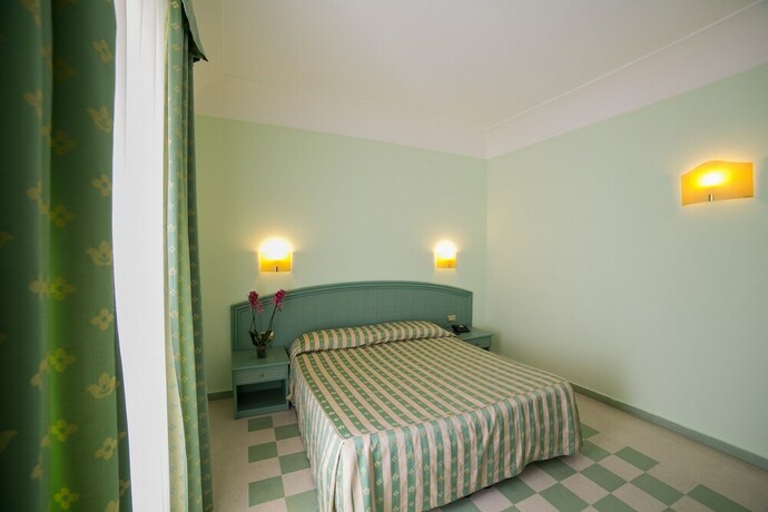 Imagen de la habitación del Hotel Gran Bretagna Boutique Hotel Ortigia. Foto 26