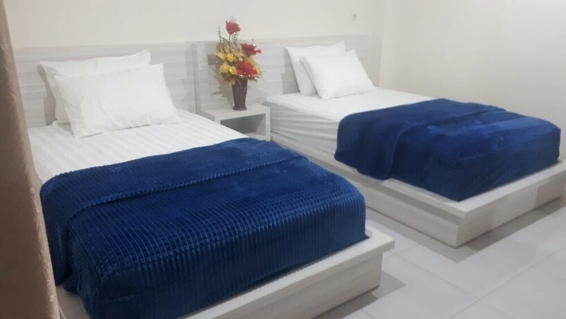 Imagen de la habitación del Hotel Granada Inn Palu. Foto 17