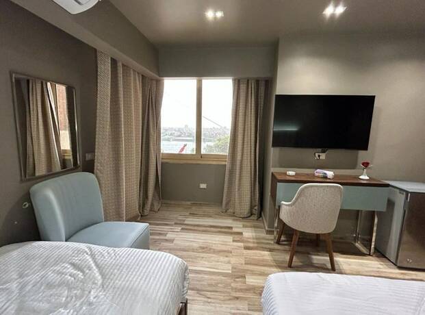 Imagen de la habitación del Hotel Grand Bayan at Nile Plaza. Foto 16