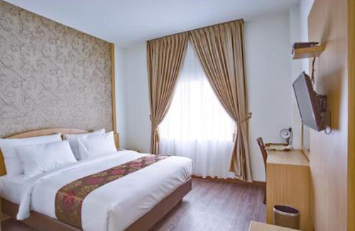 Imagen de la habitación del Hotel Grand Bayu Hill. Foto 17