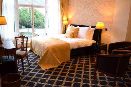 Imagen de la habitación del Hotel Grand Boutique Huis Vermeer. Foto 11