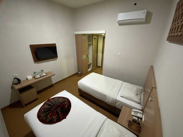 Imagen de la habitación del Hotel Grand Bunda Syariah Bukittinggi Powered By Archipelago. Foto 6