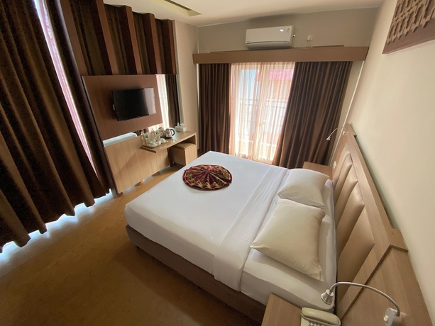 Imagen de la habitación del Hotel Grand Bunda Syariah Bukittinggi Powered By Archipelago. Foto 11