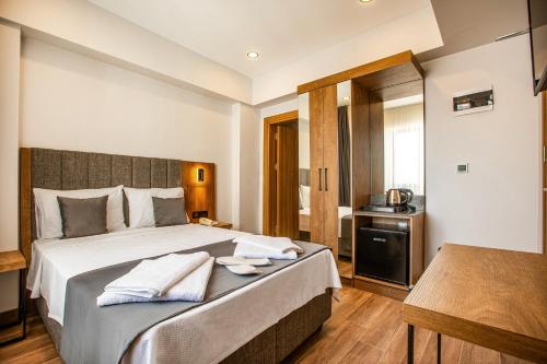 Imagen de la habitación del Hotel Grand Business. Foto 16