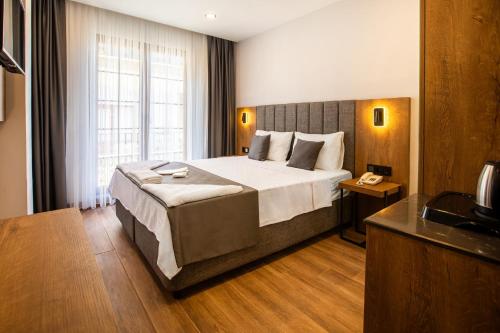 Imagen de la habitación del Hotel Grand Business. Foto 19