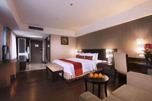 Imagen de la habitación del Hotel Grand City Hall Hotel & Serviced Residences. Foto 8