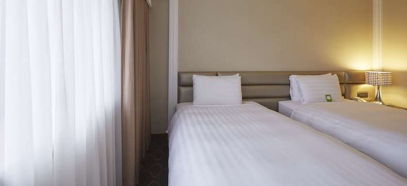 Imagen de la habitación del Hotel Grand City, Taichung. Foto 3