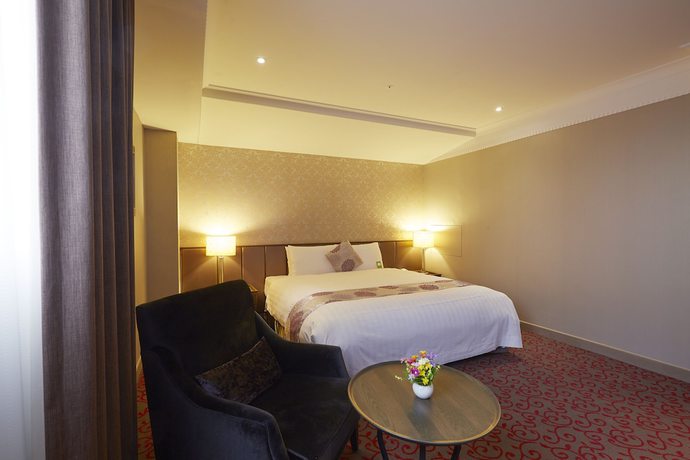 Imagen de la habitación del Hotel Grand City, Taichung. Foto 6