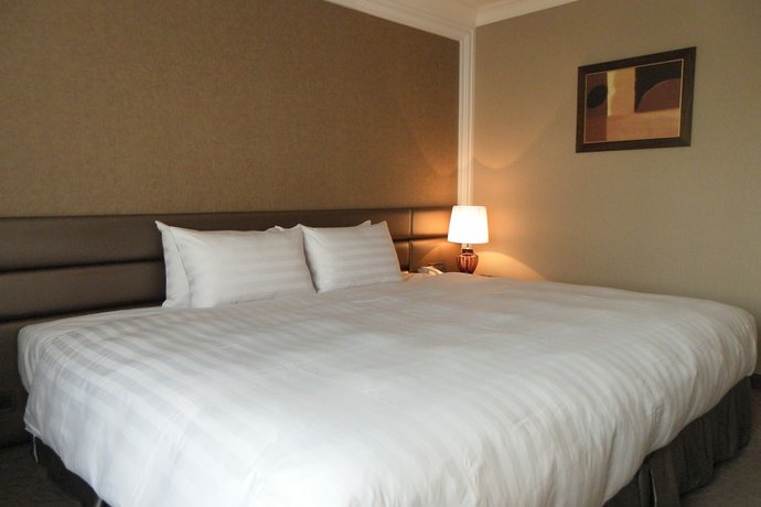 Imagen de la habitación del Hotel Grand City, Taichung. Foto 12