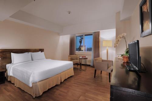 Imagen de la habitación del Hotel Grand Dafam Braga Bandung. Foto 2