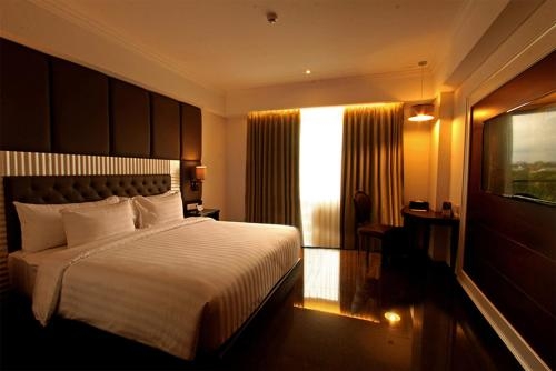 Imagen de la habitación del Hotel Grand Dafam Rohan Jogja. Foto 6