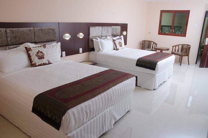 Imagen de la habitación del Hotel Grand Diamond Suites Trinidad. Foto 10