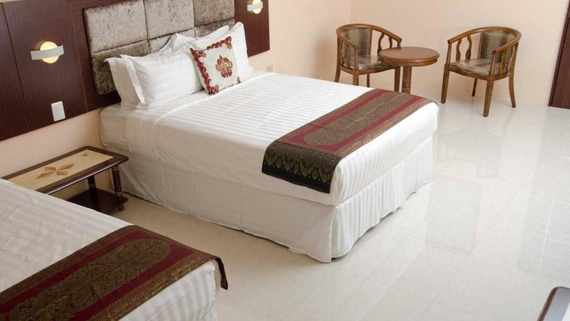 Imagen de la habitación del Hotel Grand Diamond Suites Trinidad. Foto 16