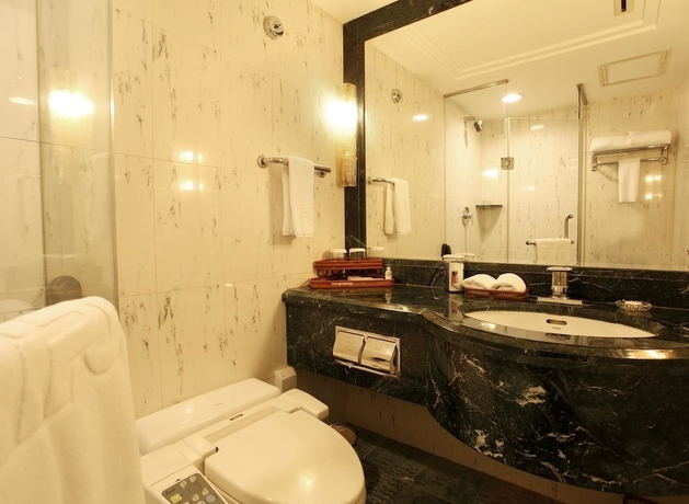 Imagen de la habitación del Hotel Grand Dynasty - Beijing. Foto 7