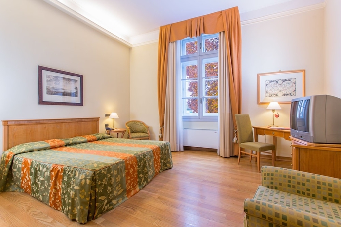 Imagen de la habitación del Hotel Grand Entourage Palazzo Strassoldo. Foto 13