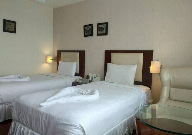 Imagen de la habitación del Hotel Grand Gardenia. Foto 28