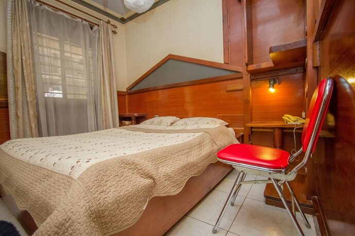 Imagen de la habitación del Hotel Grand Holiday International. Foto 15