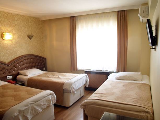 Imagen de la habitación del Hotel Grand Hotel Duman. Foto 11