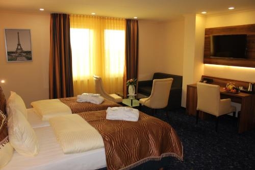 Imagen de la habitación del Hotel Grand Hotel Empire. Foto 10