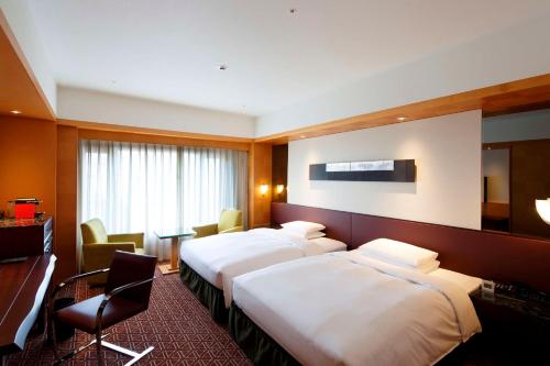 Imagen de la habitación del Hotel Grand Hyatt Fukuoka. Foto 20