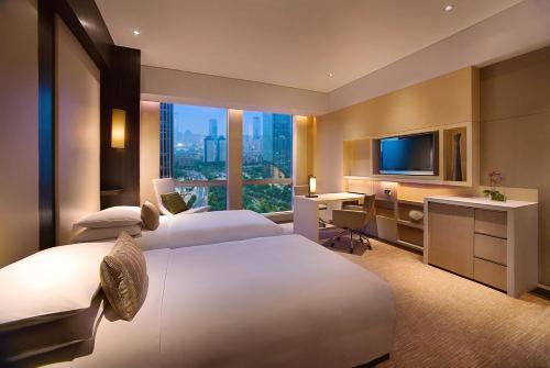Imagen de la habitación del Hotel Grand Hyatt Guangzhou. Foto 9