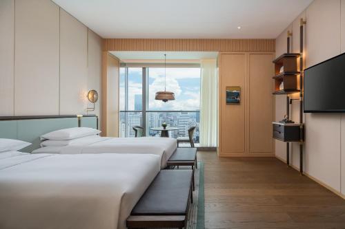 Imagen de la habitación del Hotel Grand Hyatt Kunming. Foto 9