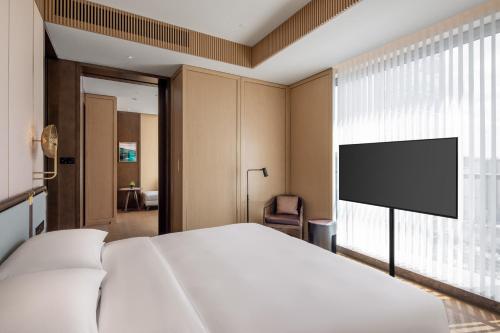 Imagen de la habitación del Hotel Grand Hyatt Kunming. Foto 18
