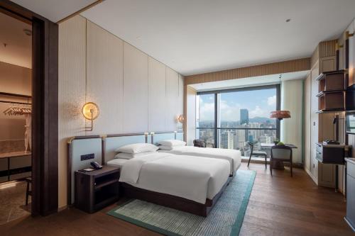 Imagen de la habitación del Hotel Grand Hyatt Kunming. Foto 19