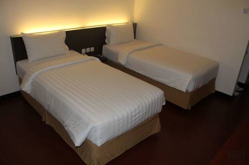 Imagen de la habitación del Hotel Grand Imawan. Foto 6