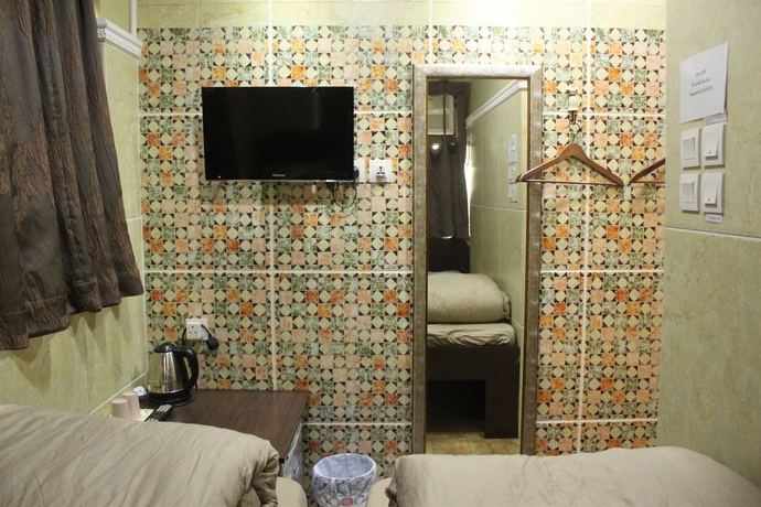 Imagen de la habitación del Hotel Grand Inn, Chung King Mansion. Foto 11