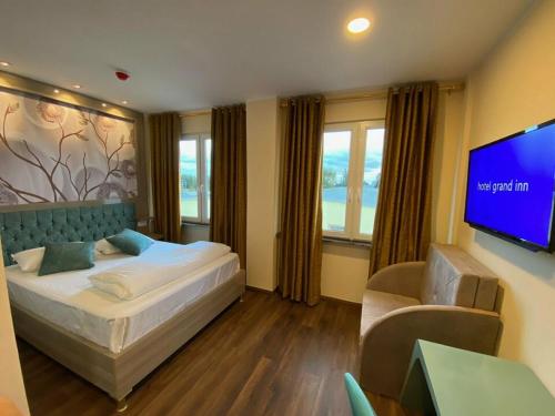 Imagen de la habitación del Hotel Grand Inn. Foto 3