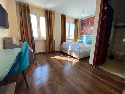 Imagen de la habitación del Hotel Grand Inn. Foto 11