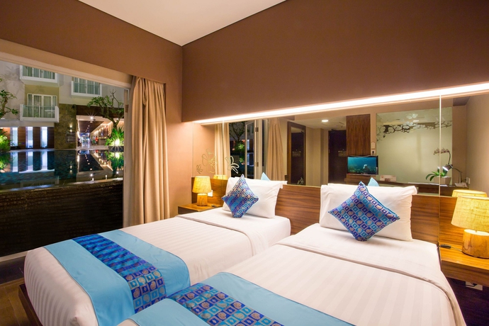 Imagen de la habitación del Hotel Grand Ixora Kuta Resort. Foto 9