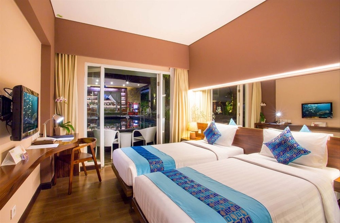 Imagen de la habitación del Hotel Grand Ixora Kuta Resort. Foto 11