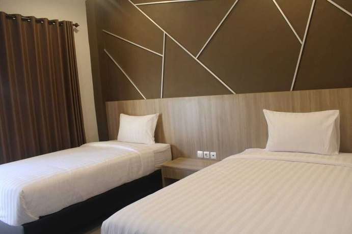 Imagen de la habitación del Hotel Grand Kuta. Foto 3