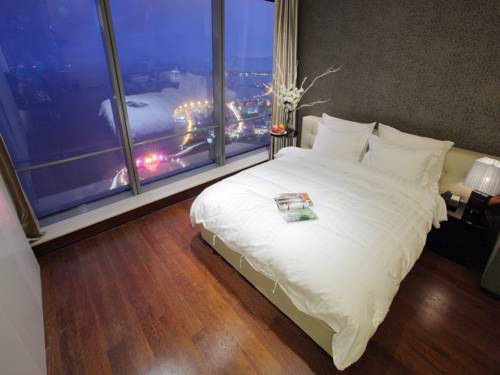Imagen de la habitación del Hotel Grand Madison Qingdao Harbour View Central. Foto 3