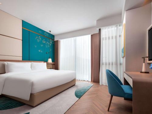 Imagen de la habitación del Hotel Grand Mercure Hangzhou Qingshan Lake. Foto 16