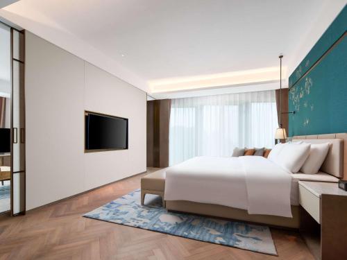 Imagen de la habitación del Hotel Grand Mercure Hangzhou Qingshan Lake. Foto 18