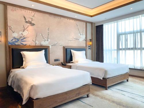 Imagen de la habitación del Hotel Grand Mercure Kunming South. Foto 17