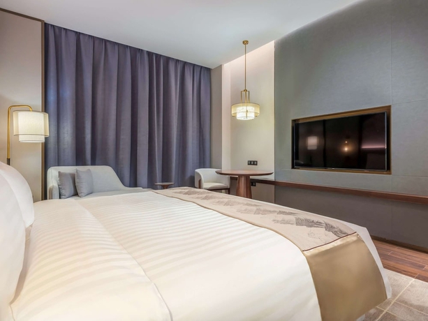 Imagen de la habitación del Hotel Grand Mercure Pingxiang Kaiguang. Foto 7