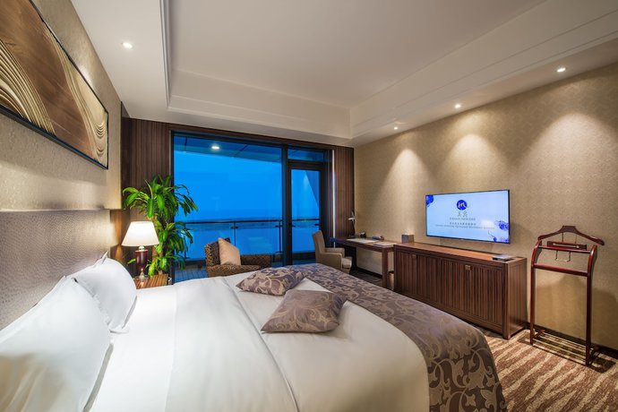 Imagen de la habitación del Hotel Grand Mercure Qingdao Airlines. Foto 9
