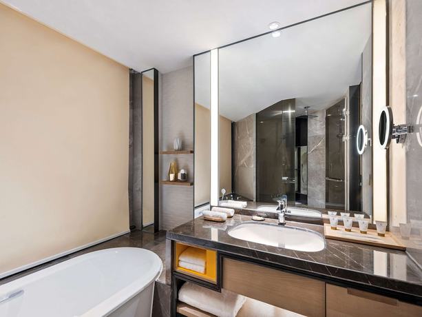 Imagen de la habitación del Hotel Grand Mercure Shanghai Lingang. Foto 10
