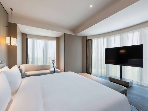 Imagen de la habitación del Hotel Grand Mercure Shanghai Lingang. Foto 11
