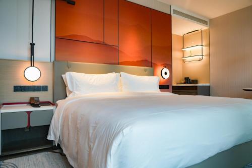 Imagen de la habitación del Hotel Grand Mercure Yichang Waitan. Foto 13