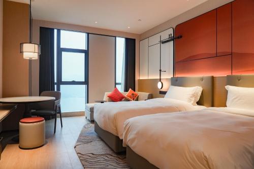 Imagen de la habitación del Hotel Grand Mercure Yichang Waitan. Foto 16