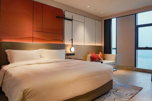 Imagen de la habitación del Hotel Grand Mercure Yichang Waitan. Foto 18