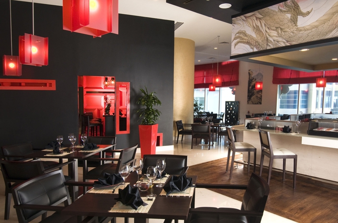 Imagen del bar/restaurante del Hotel Grand Millennium Al Wahda. Foto 3