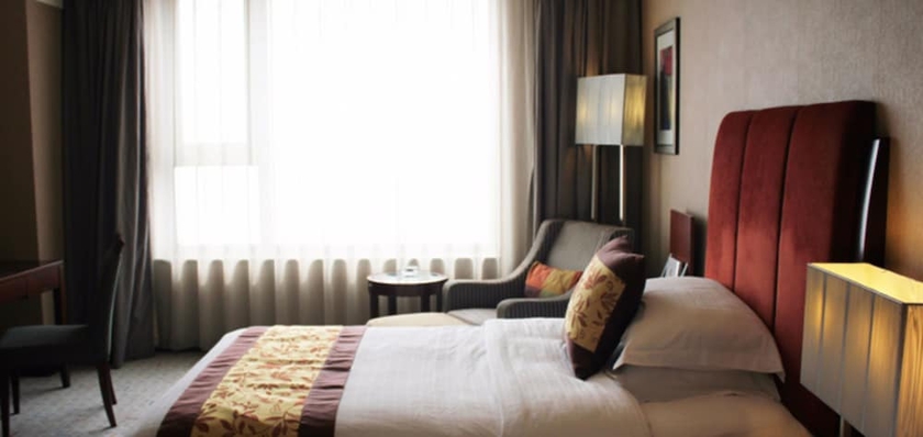 Imagen de la habitación del Hotel Grand New Century Binhai Tianjin. Foto 2