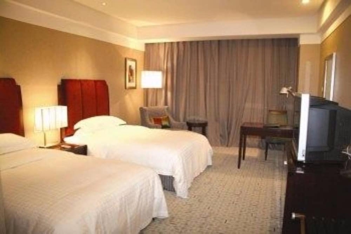 Imagen de la habitación del Hotel Grand New Century Binhai Tianjin. Foto 4