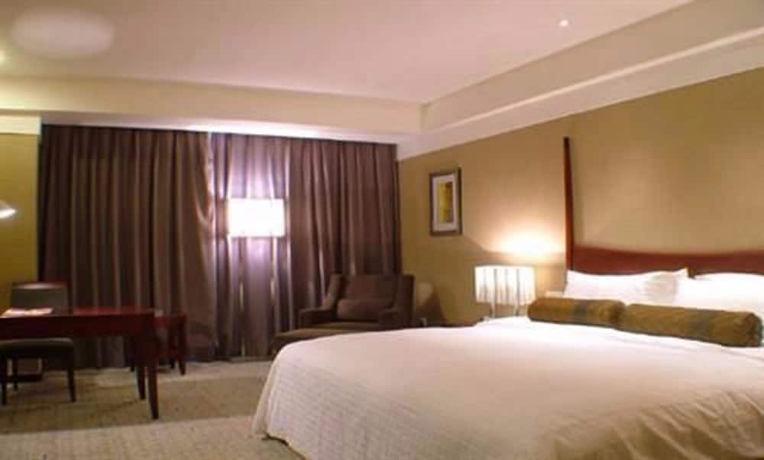 Imagen de la habitación del Hotel Grand New Century Binhai Tianjin. Foto 7